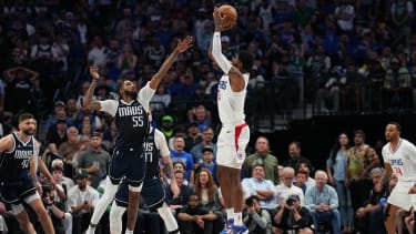DALLAS, TX - APRIL 28: Paul George #13 of the LA Clippers shoots the ball during the game against the Dallas Mavericks during Round 1 Game 4 of the 2024NBA Playoffs on April 28, 2024 at the American Airlines Center in Dallas, Texas. NOTE TO USER: User expressly acknowledges and agrees that, by downloading and or using this photograph, User is consenting to the terms and conditions of the Getty Images License Agreement. Mandatory Copyright Notice: Copyright 2024 NBAE (Photo by Glenn James/NBAE via Getty Images)