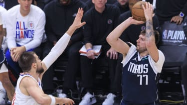 May 1, 2024, Los Angeles, California, USA: Luka Doncic 77 of the Dallas Mavericks makes a three point shot while Ivica Zubac 40 of the Los Angeles Clippers defends the basket during their NBA, Basketball Herren, USA Playoff game on Wednesday May 1, 2024 at Crypto.com Arena in Los Angeles, California. Clippers lose to Mavericks, 93-123. ARIANA RUIZ PI Los Angeles U.S - ZUMAp124 20240501_zaa_p124_042 Copyright: xArianaxRuizx