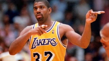 ** FILE ** Los Angeles Lakers' Earvin "Magic" Johnson gestures against the Boston Celtics during the NBA Championship series in this June 15, 1987 file photo in Inglewood, Calif.. (AP Photo/Lennox Mclendon)