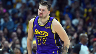 Feb 22, 2025; Denver, Colorado, USA; Los Angeles Lakers guard Luka Doncic (77) celebrates after a basket during the first half against the Denver Nuggets at Ball Arena. Mandatory Credit: Christopher Hanewinckel-Imagn Images