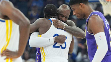 Los Angeles Lakers forward LeBron James, facing, hugs Golden State Warriors forward Draymond Green before an NBA basketball game in San Francisco, Thursday, April 9, 2026. (AP Photo/Jeff Chiu)