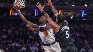 Dec 7, 2025; New York, New York, USA;  New York Knicks forward Og Anunoby (8) drives past Orlando Magic forward Paolo Banchero (5) in the first quarter at Madison Square Garden. Mandatory Credit: Wendell Cruz-Imagn Images