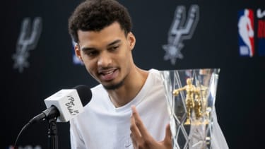 San Antonio Spurs' Victor Wembanyama speaks after receiving his 2023-24 NBA Rookie of the Year trophy during an NBA basketball news conference, Saturday, May 11, 2024, in San Antonio. (AP Photo/Darren Abate)