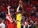 Apr 24, 2026; Houston, Texas, USA; Los Angeles Lakers forward LeBron James (23) scores a three-point basket late in the fourth quarter against the Houston Rockets during game three of the first round of the 2026 NBA Playoffs at Toyota Center. Mandatory Credit: Troy Taormina-Imagn Images