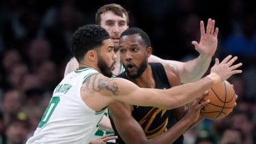 Cleveland Cavaliers forward Evan Mobley, right, is defended by Boston Celtics forward Jayson Tatum during the first half of Game 2 of an NBA basketball second-round playoff series Thursday, May 9, 2024, in Boston. (AP Photo/Steven Senne)