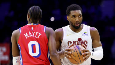 PHILADELPHIA, PENNSYLVANIA - JANUARY 16: Donovan Mitchell #45 of the Cleveland Cavaliers walks by Tyrese Maxey #0 of the Philadelphia 76ers before the first half at Xfinity Mobile Arena on January 16, 2026 in Philadelphia, Pennsylvania. NOTE TO USER: User expressly acknowledges and agrees that, by downloading and or using this photograph, User is consenting to the terms and conditions of the Getty Images License Agreement. (Photo by Emilee Chinn/Getty Images)