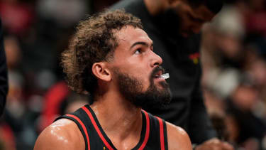 Atlanta Hawks guard Trae Young (11) sits on the bench during the first half of an NBA basketball game, Friday, Dec. 26, 2025, in Atlanta. (AP Photo/Mike Stewart)