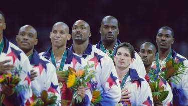 L - R,  Mitch Richmond, Reggie Miller, Karl Malone, John Stockton, Shaquille O'Neal, Gary Payton and Hakeem Olajuwon of the United States Men's basketball team stand on the podium to sing the national anthem after winning the gold medal in the final game of the Men's Olympic Basketball Tournament against Yugoslavia at the XXVI Summer Olympic Games on 3rd August 1996 at the Georgia Dome in Atlanta, Georgia, United States. The United States won the game and tournament 95 - 69.  (Photo by Jed Jacobsohn/Allsport/Getty Images)