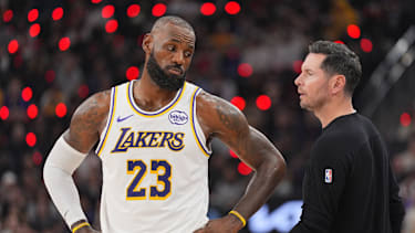 Los Angeles Lakers forward Lebron James (23) talks with head coach JJ Redick during the first half of an NBA basketball game against the Los Angeles Clippers Saturday, Dec. 20, 2025, in Inglewood, Calif. (AP Photo/Jae C. Hong)