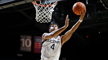 UConn forward Dwayne Koroma (4) during the second half of an exhibition NCAA basketball game against Boston College, Monday, Oct. 13, 2025, in Uncasville, Conn. (AP Photo/Jessica Hill)